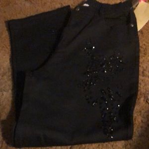 Black denim with beaded embellishments.L